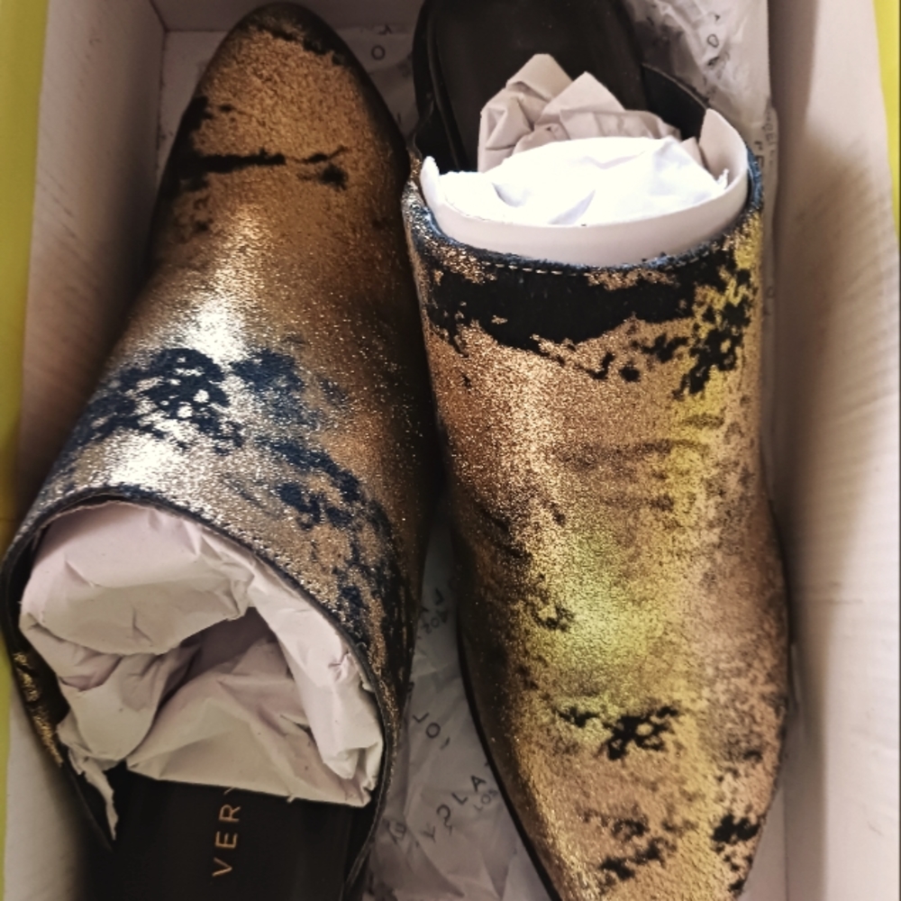 Very Volatile women's gold and black shoes.